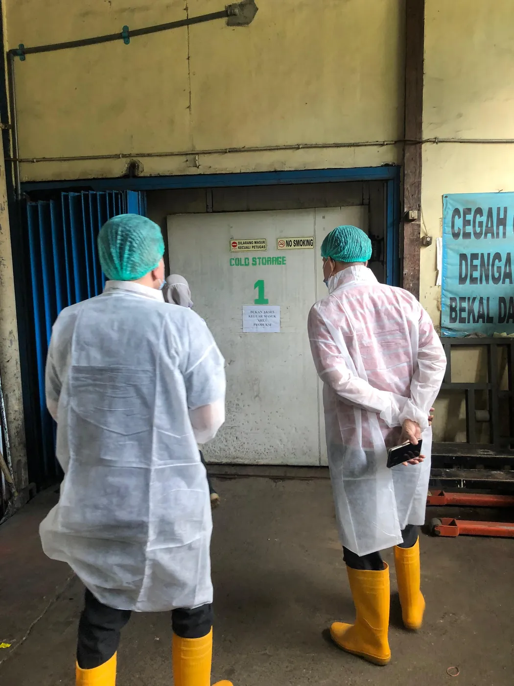 Staff following hygiene protocol at the facility entrance